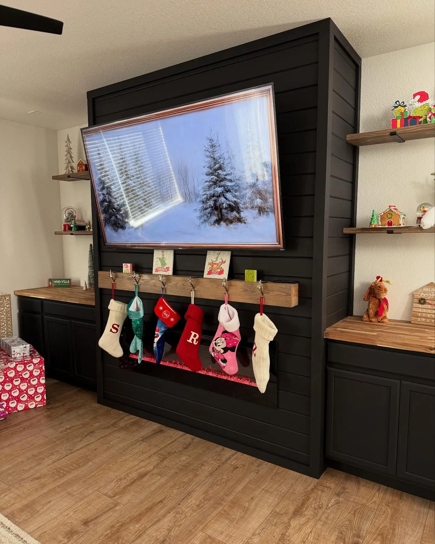Completed custom fireplace built-in wall with balanced cabinetry and shelving