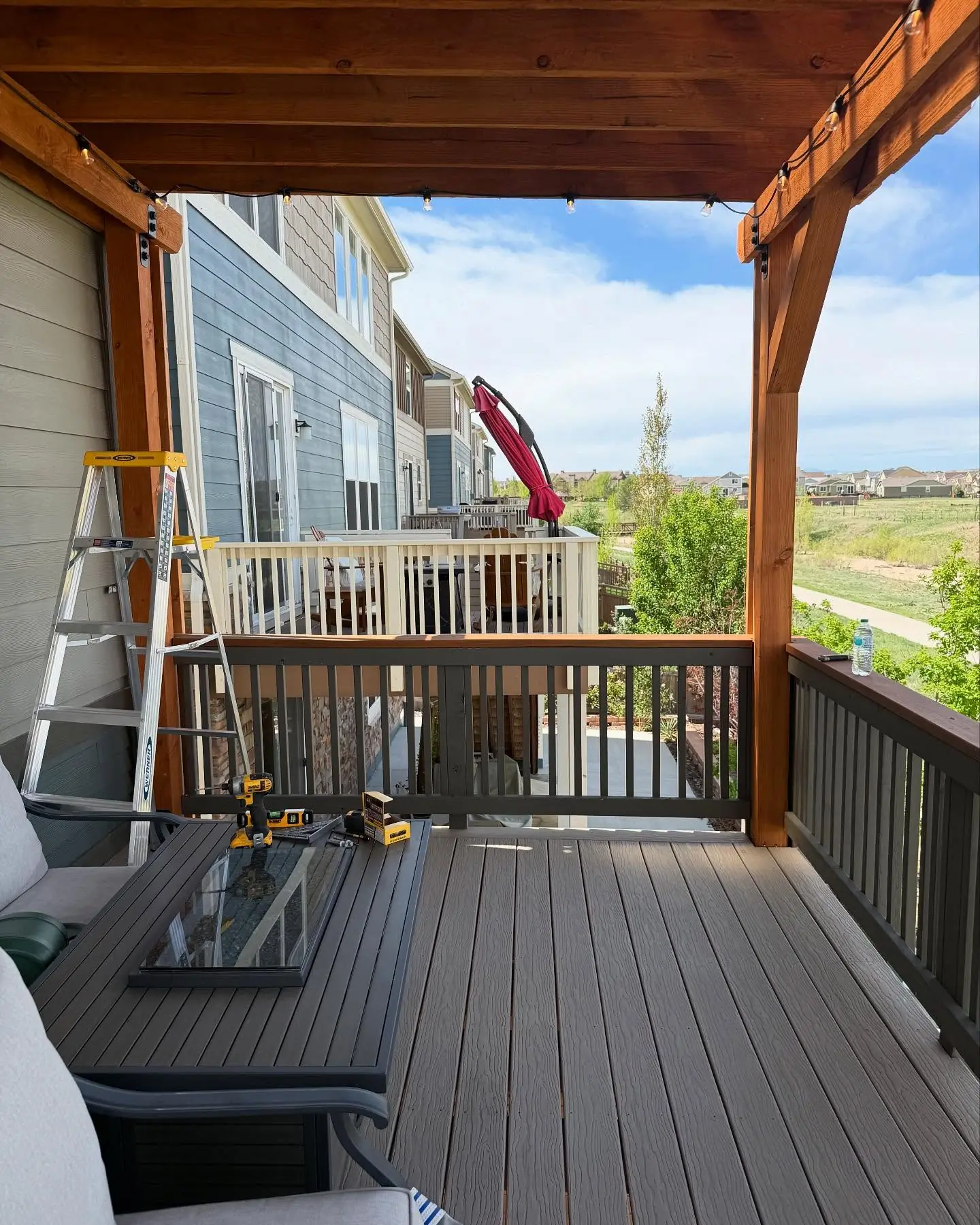Finished custom privacy wall on a deck with clean vertical boards by Mountain Ridge Renovations