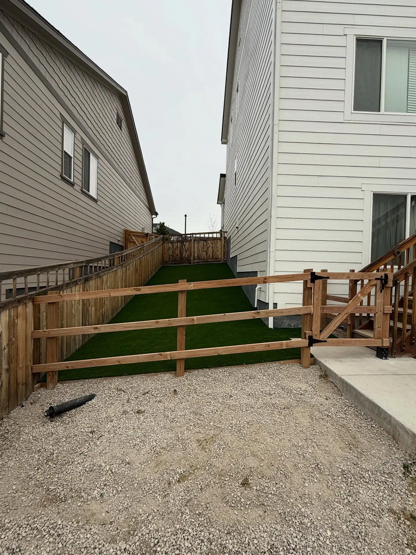 Fenced dog run with artificial turf built by Mountain Ridge Renovations in the Parker area