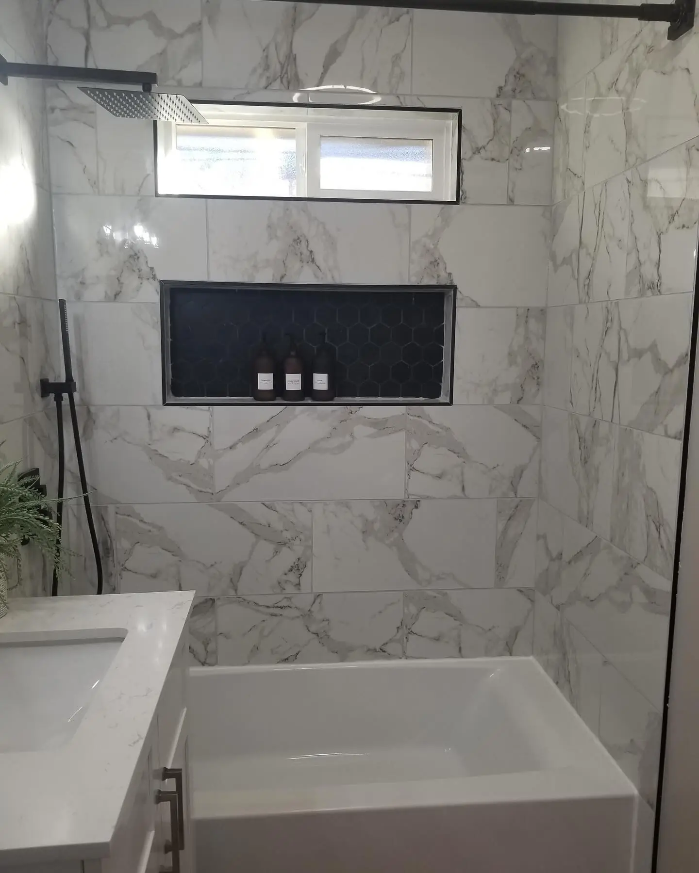 Bathroom tile and shower detail from a full remodel by Mountain Ridge Renovations