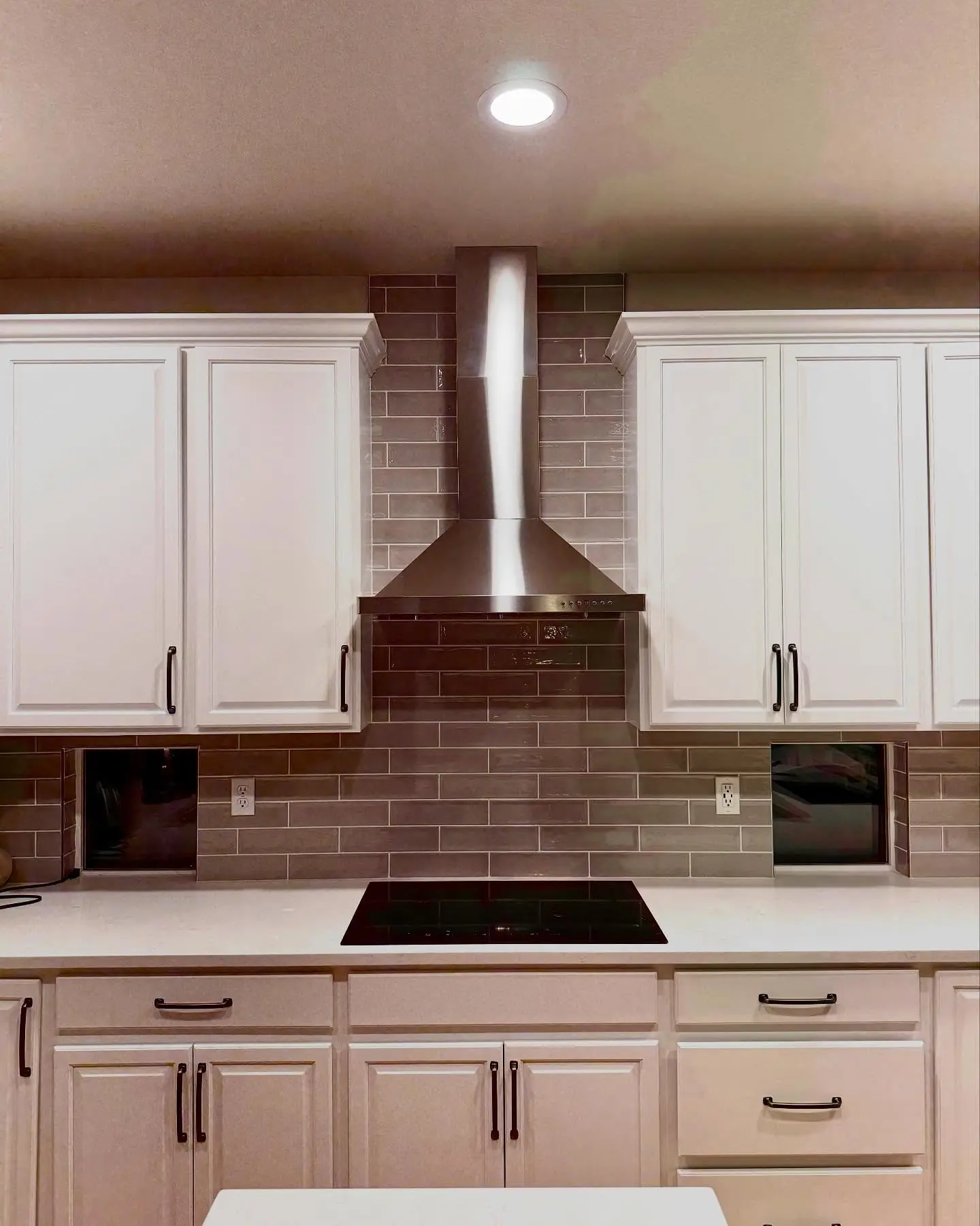 Kitchen range installation during a home remodel by Mountain Ridge Renovations
