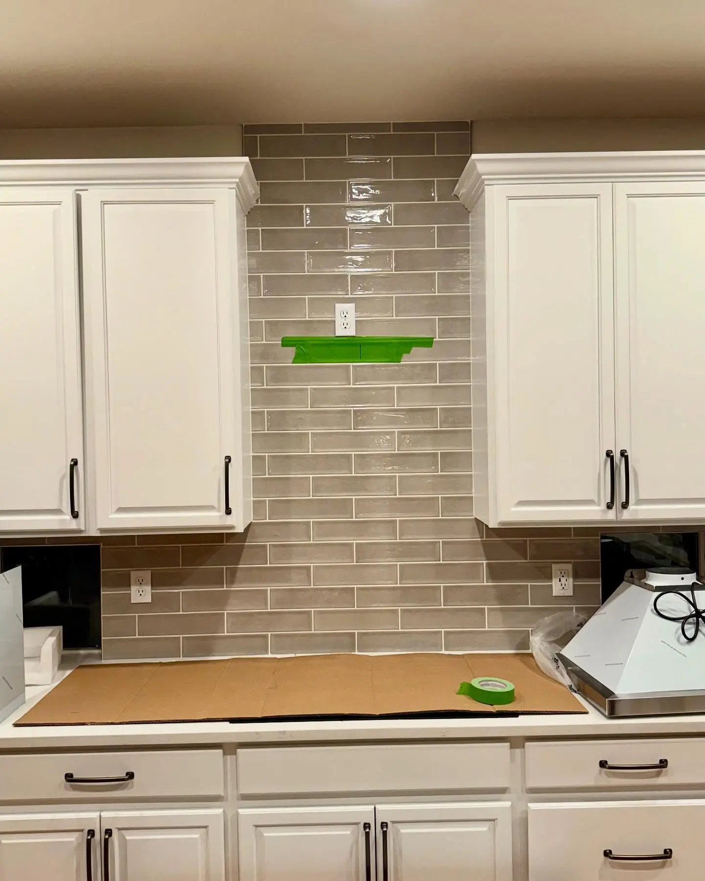 Finished range and hood install with clean surrounds in a South Denver kitchen