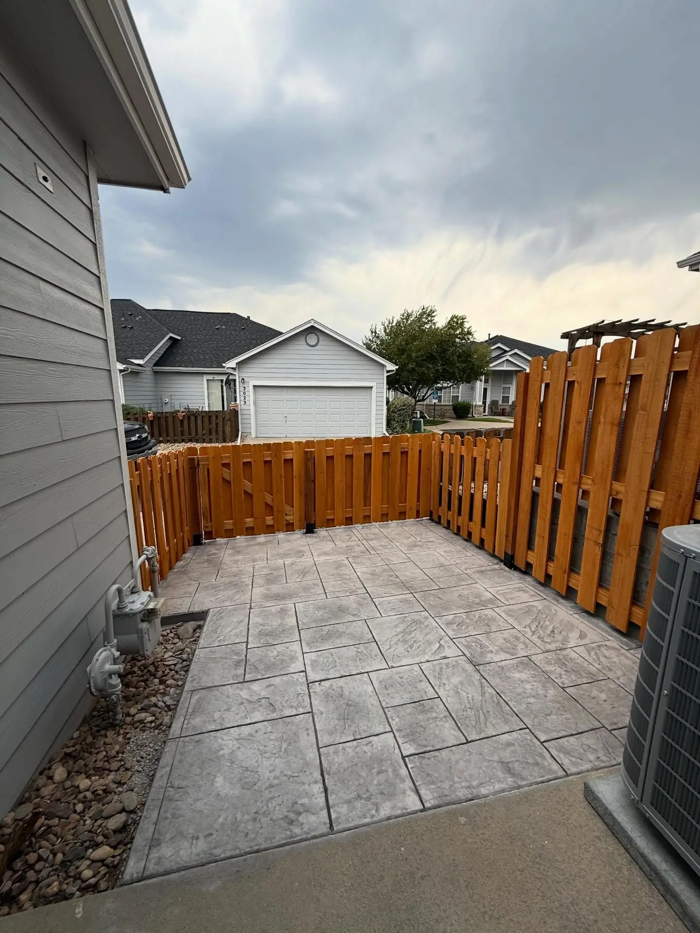Stamped concrete patio and fence upgrade in Parker, Colorado