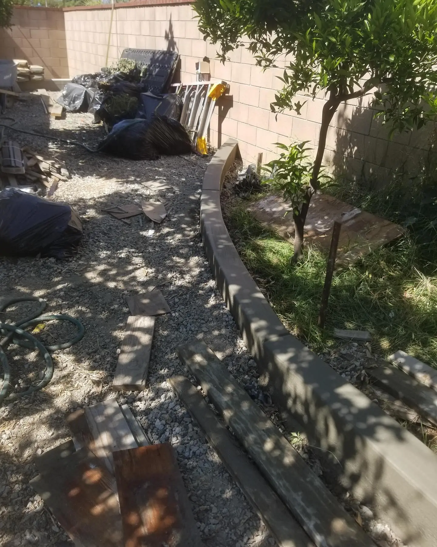 Turf installation area prepared before curbing by Mountain Ridge Renovations